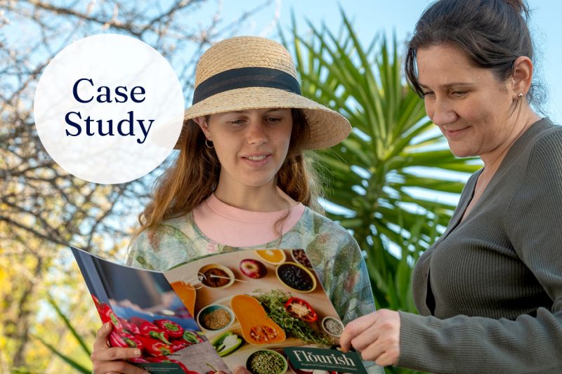 Two people looking at a food system document together