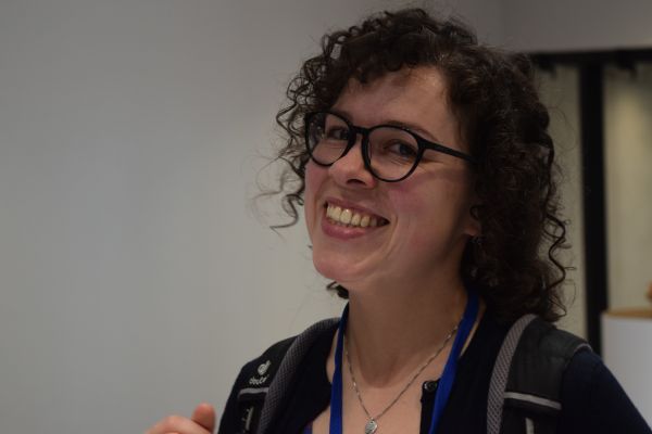 A close-up of a conference attendee
