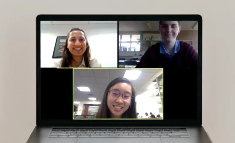 Three people on a Zoom meeting on a computer monitor.