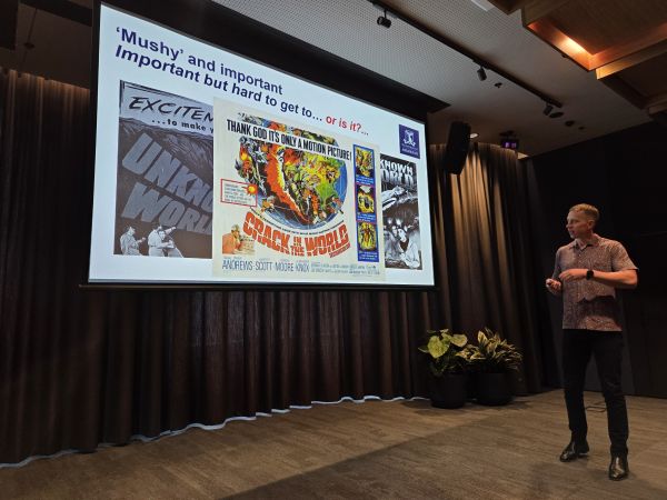 A presenter and their slide; the title 