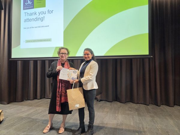 The Dean of Science, Moira O'Bryan, presenting a certificate to a speaker