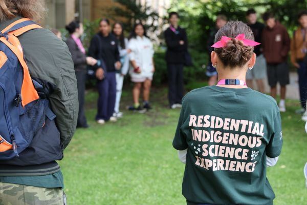 Back of student while standing in a yarning circle