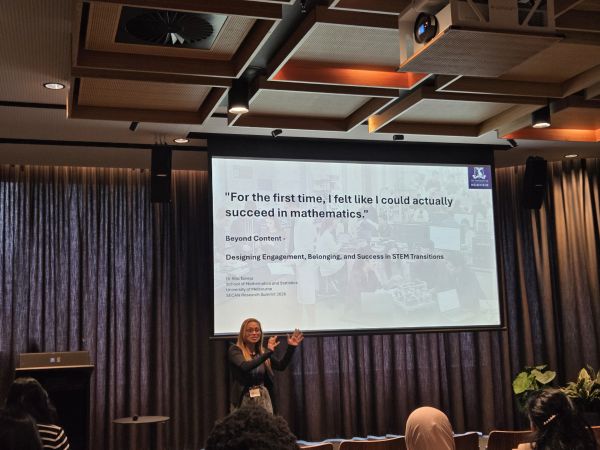 A presenter and their slide; the title 