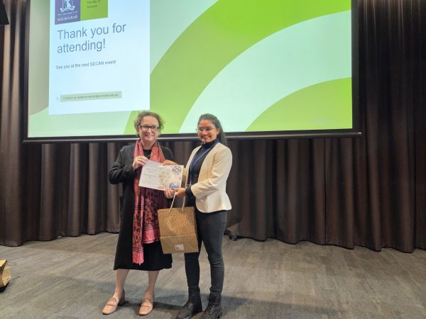 The Dean of Science, Moira O'Bryan, presenting a certificate to a speaker