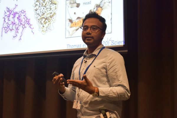 A presenter and one corner of their slide