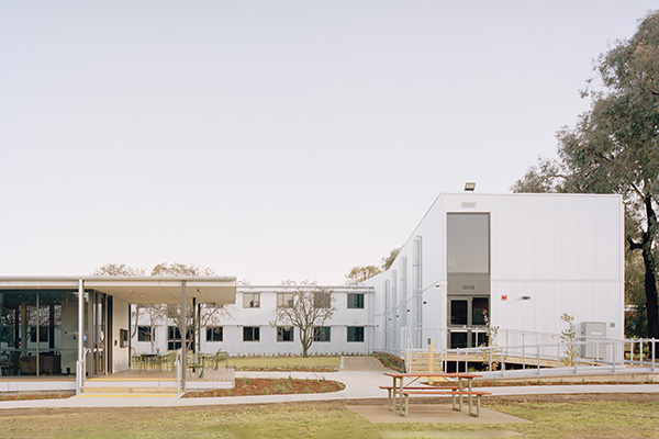View toward two storey L shaped accommodation building.