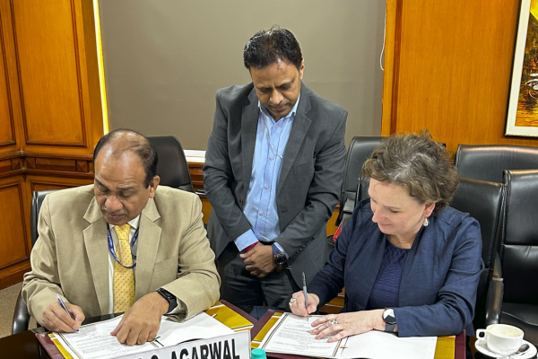 Dr Rakesh Chandra Agrawal, Deputy Director General (Agricultural Education) ICAR signing the MoU with Professor Moira O'Bryan, Dean of Science