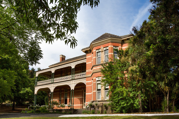 Tremearne House on Creswick campus, two story red brick building surrounded by trees.