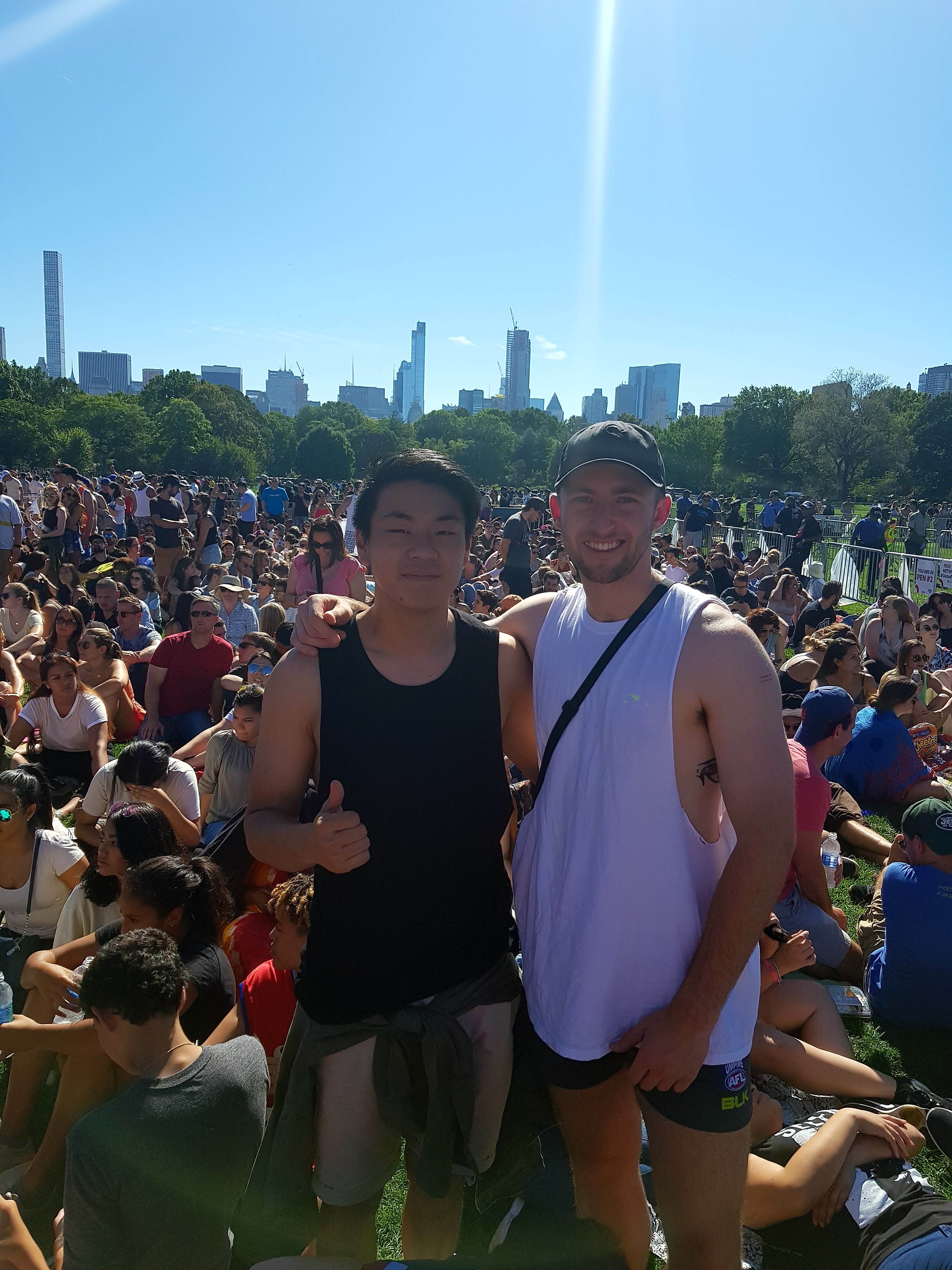 Two men posing in a crowd