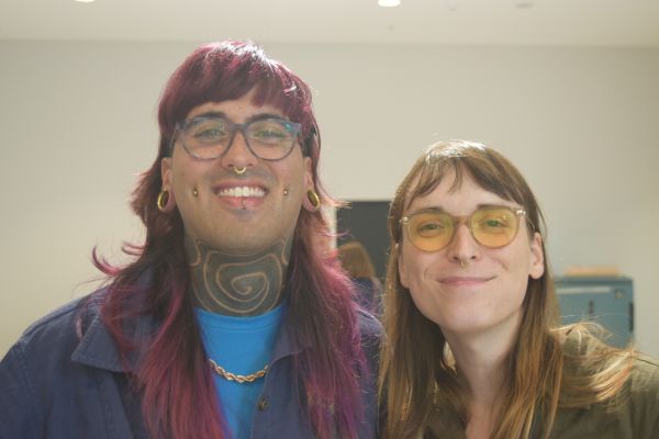 Two conference attendees posing for the camera