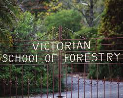 Iron gates with the words Victorian School of Forestry on them.