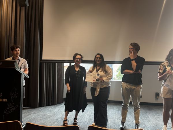 The Dean of Science presenting a speaker with a certificate