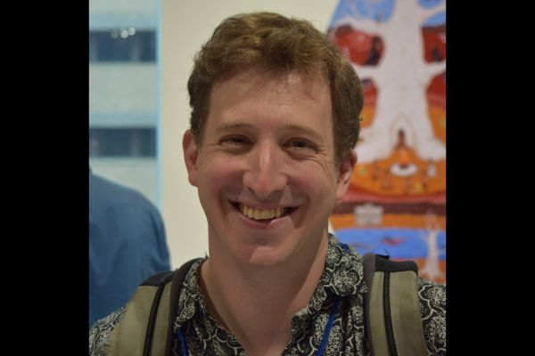 A close-up of a conference attendee