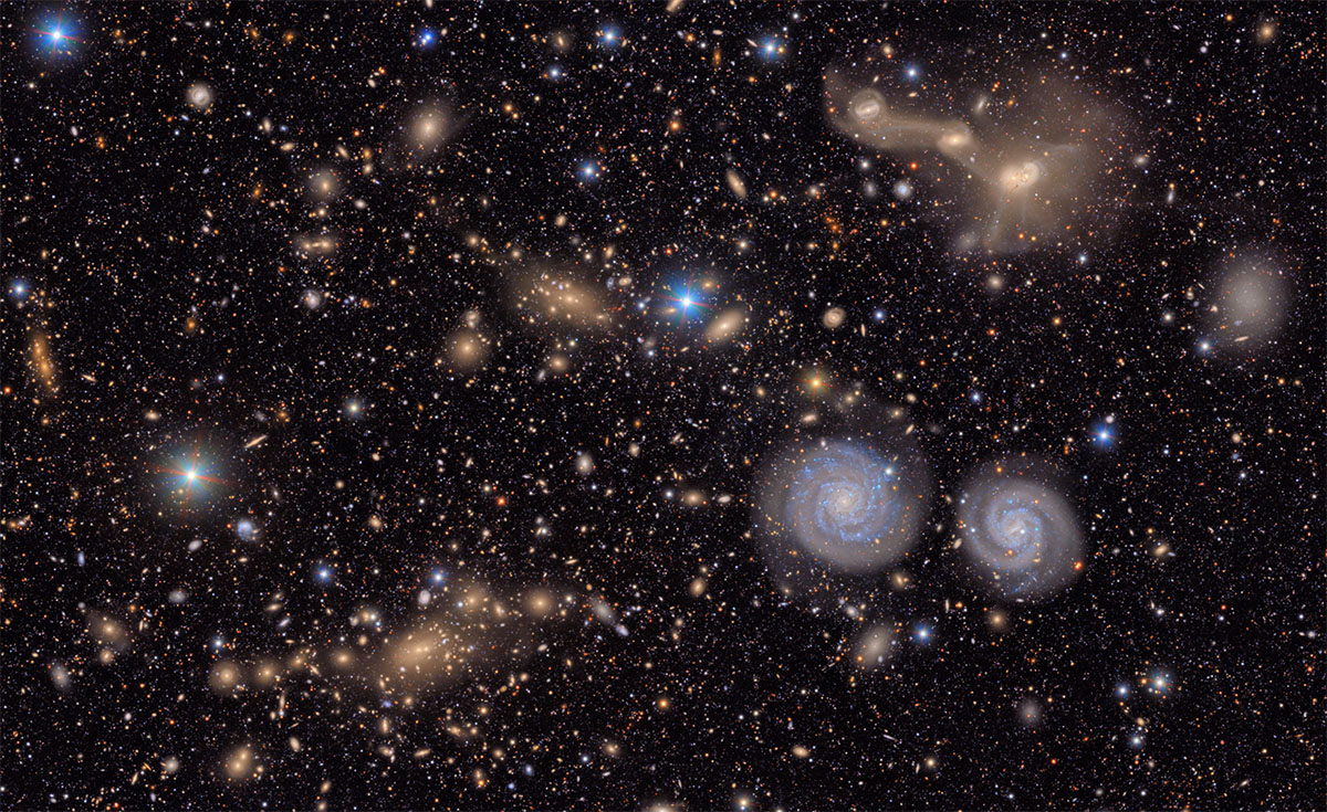 This image shows another small section of NSF-DOE Vera C. Rubin Observatory's total view of the Virgo cluster. Visible are two prominent spiral galaxies (lower right), three merging galaxies (upper right), several groups of distant galaxies, many stars in the Milky Way galaxy and more.
