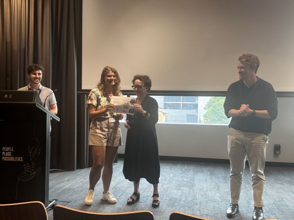 The Dean of Science, Moira O'Bryan, presenting a speaker with a certificate