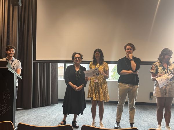 The Dean of Science presenting a speaker with a certificate