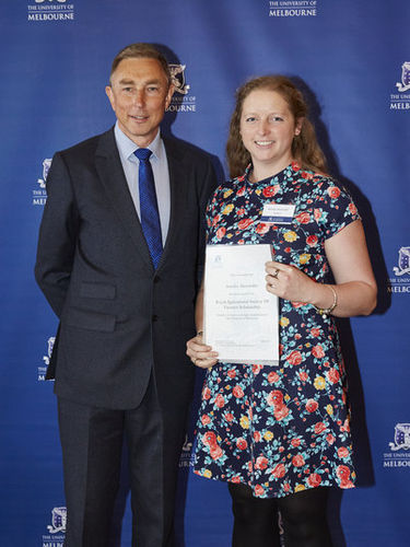 Annika being presented with her Royal Agricultural Society of Victoria Scholarship Certificate by John Fazakerley