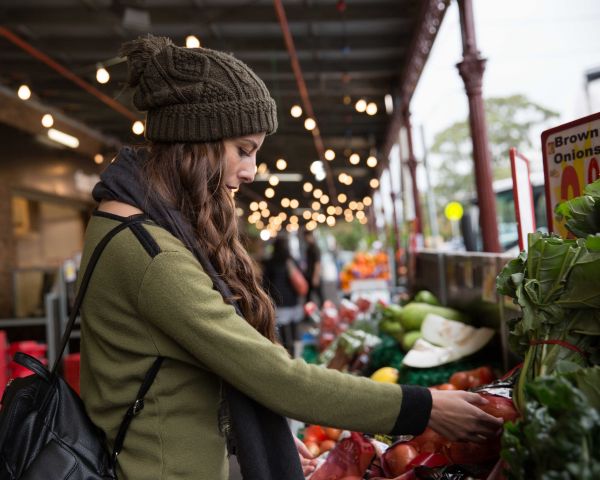 Woman selecting food item in outdoor market