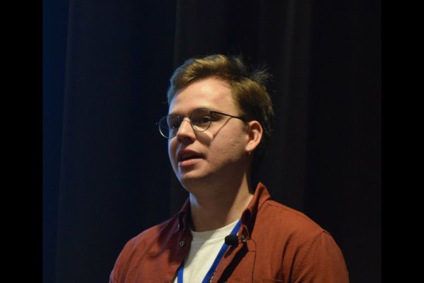 A close-up of a conference attendee