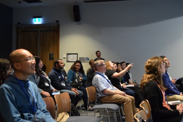 A wide view of the audience of a presentation
