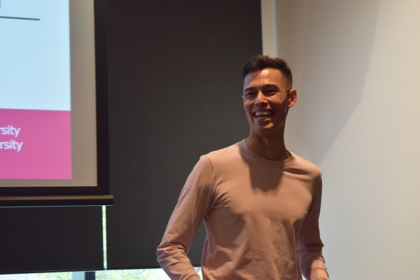 A presenter and a corner of their slide