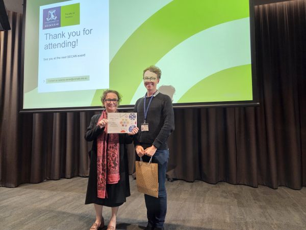 The Dean of Science, Moira O'Bryan, presenting a certificate to a speaker