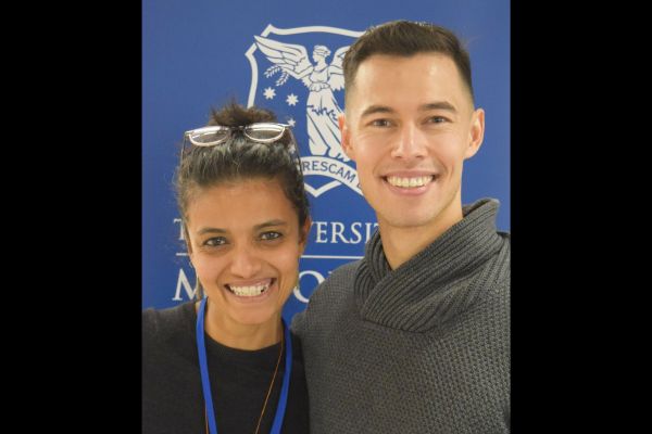 A close-up of two conference attendees