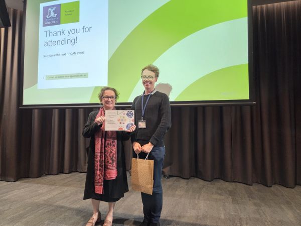 The Dean of Science, Moira O'Bryan, presenting a certificate to a speaker