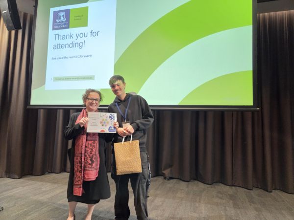 The Dean of Science, Moira O'Bryan, presenting a certificate to a speaker