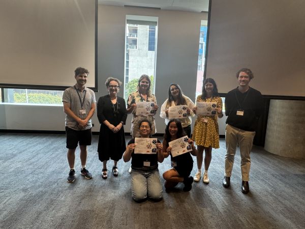 Speakers with certificates, summit organisers and the Dean of Science posing for the camera