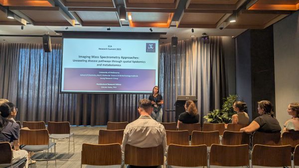 A speaker in front of a slide labelled 'Imaging Mass Spectrometry Approaches'
