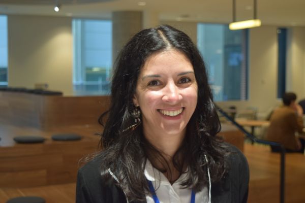 A close-up of a conference attendee