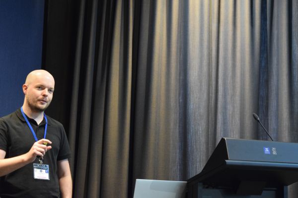 A presenter near the podium