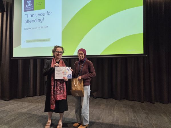 The Dean of Science, Moira O'Bryan, presenting a certificate to a speaker