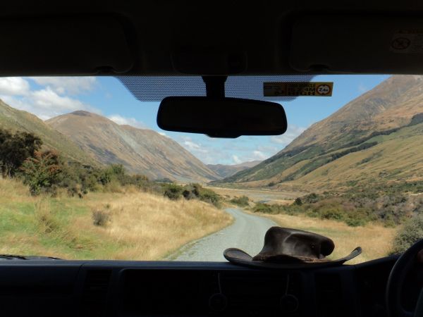 View of Nea Zealand scenery from the windshield of a car